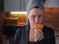 Sick woman trying to sense smell of fresh orange Royalty Free Stock Photo