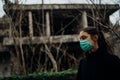 Sick woman wearing hygienic protective mask.Respiratory system infectious disease victim.Lethal lung disease.