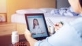 Sick woman use video conference, make online consultation with doctor on digital tablet, patient ask doctor about illness