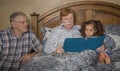 Family reads with woman on oxygen Royalty Free Stock Photo