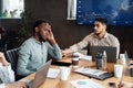 Sick young black male worker suffering from headache Royalty Free Stock Photo