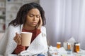 Sick young black woman suffering from headache or cold at home Royalty Free Stock Photo