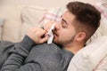 Sick young man sneezing. Influenza virus Royalty Free Stock Photo