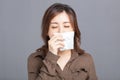 Sick young woman  blowing her nose Royalty Free Stock Photo