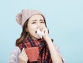 Sick young woman blowing her nose Royalty Free Stock Photo