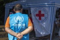 Sid, Serbia - October 3, 2015: UNHCR staff member waiting for the arrival of a bus of refugees in Berkasovo, Serbo-Croatian border