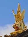 Side view of Golden statue of poetry on top of the opera of Paris, France Royalty Free Stock Photo