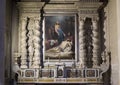 Side Altar of the Duomo Cathedral featuring a painting with Mary mourning over the dead Jesus in Lecce, Italy