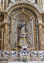 Side Altar of the Duomo Cathedral featuring a statue of our Lady of the Assumption in Lecce, Italy