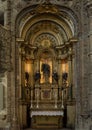 Side altar with a female saint wearing a crown and holding a bible in the Church of Santa Maria de Belem in Lisbon, Portugal. Royalty Free Stock Photo