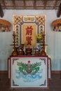 Side altar in front of text at Dinh Phu Vinh community center in Nha Trang, Vietnam