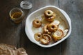 Side apples topped nuts honey cinnamon baking dish wooden table Royalty Free Stock Photo