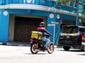 Side And Back View Of A RunnerMyRun Delivery Man On His Bike