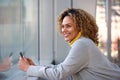 Side of beautiful african american woman smiling with mobile phone Royalty Free Stock Photo