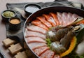 Side of beef garnished with sesame, and shellfish with prawns arranged on the tray Combined with vegetables for grill set on the Royalty Free Stock Photo