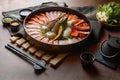 Side of beef garnished with sesame, and shellfish with prawns arranged on the tray combined with vegetables for grill set on the Royalty Free Stock Photo