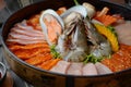 Side of beef garnished with sesame, and shellfish with prawns arranged on the tray combined with vegetables for grill set on the Royalty Free Stock Photo