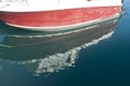 Side of the boat and its reflection in sea water Royalty Free Stock Photo