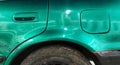 Side bodypart of a vintage neon green car Royalty Free Stock Photo