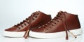 Side of brown pair of casual sneakers