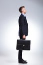 Side of business man with briefcase Royalty Free Stock Photo