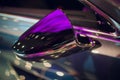 Side car mirror close-up. Details of silver car. Royalty Free Stock Photo