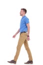 Side of casual young man walking Royalty Free Stock Photo