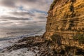 Side of Cliff with Rocks and Ocean at Sunset Cliffs Royalty Free Stock Photo