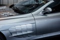 Side, close up view of modern grey cabriolet car with mirror, hood and windshield wipers Royalty Free Stock Photo