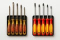 Side-by-side comparison of an old, worn screwdriver set and a new Royalty Free Stock Photo