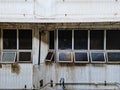 Side of concrete building, There are windows and pipes. Royalty Free Stock Photo