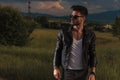 Side of a cool man in leather jacket looking away Royalty Free Stock Photo