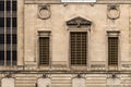 Side of decorative vintage block building with relief sculptures