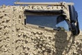 The side door and small bulletproof glass window of a Foxhound Infantry support and armoured Patrol Vehicle.