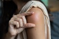 Side effect of the vaccine - shoulder skin redness and pain. Covid-19 vaccination reaction. Woman skin itchy and