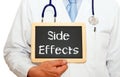 Side Effects - doctor holding chalkboard with text Royalty Free Stock Photo