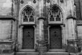 Side entrance of the gothic Vysehrad cathedral in Prague surrounded by beautiful stone wall and pillars Royalty Free Stock Photo