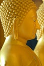 The side face of the Buddha in the temple. Royalty Free Stock Photo