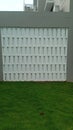 Side fence of the house with roster wall Royalty Free Stock Photo