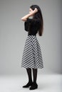 side full figure portrait with Zebra-striped herringbone skirt Royalty Free Stock Photo