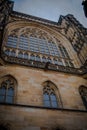 Side of the gothic Vysehrad cathedral in Prague featuring beautiful windows and stone wall and pillars Royalty Free Stock Photo