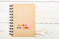 Side Hustle words made form multicolored square beads on spiral notebook cover. Concept image of passive income Royalty Free Stock Photo