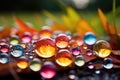 Side macro view of rainbow water drops on the ground, abstract background Royalty Free Stock Photo