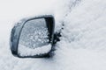 Side mirror on a car completely covered in snow Royalty Free Stock Photo