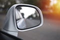 Side mirror of one car Reflecting the road and the tree view beside Royalty Free Stock Photo
