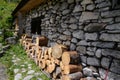 Side of old cottage with wood pile Royalty Free Stock Photo