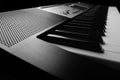 Side, perspective view of electronic synthesizer piano keys Royalty Free Stock Photo