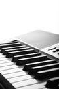 Side, perspective view of electronic synthesizer piano keys Royalty Free Stock Photo