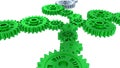 Side and Perspective View of Two Silver Gears and Several Green Royalty Free Stock Photo