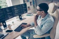 Side photo of male programmer student thinking how fix bugs error in code typing keyboard browsing his perfect html css Royalty Free Stock Photo